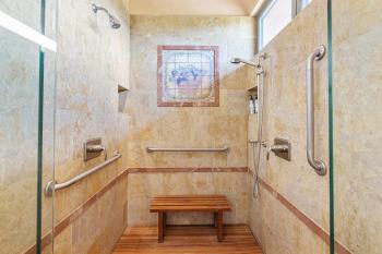 Tile shower with teak seating